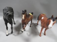 A Beswick figure of Black Beauty together with a Beswick pony and a Leonardo figure of a horse (3)
