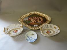 A pair of pierced ceramics twin handled baskets together with a badly damaged antique dish (3)