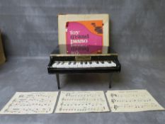 A TOY GRAND PIANO WITH OTIGINAL BOX, in working order at time of consignment
