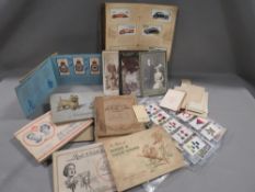 A collection of cigarette cards, post card, victorian photographs etc