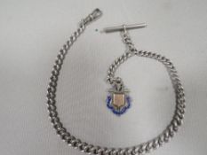 An antique silver gents pocket watch Albert chain
