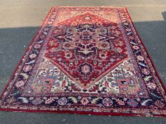 A large 20th century woollen rug 314 x 205 cm
