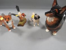 Four ceramic animal figures to include two Beswick dogs