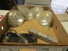 A tray of retro headlights and a boxed track control arm