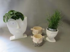 Four novelty vases