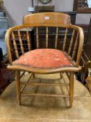 An antique oak spindle back armchair