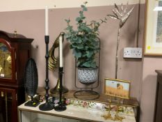 A collection of modern ornaments to include candlesticks and photo frame