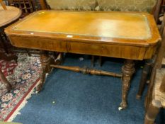 A Victorian walnut and inlaid two drawer leather top library table with nicely carved supports and