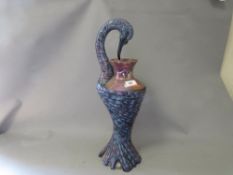 An unusual lustre effect vase in the form of a swan