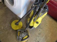 A Karcher Premium K4 pressure washer with attachments