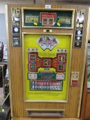 A VINTAGE ROTOMAT SUPER JOKER WALL MOUNTED FRUIT MACHINE, set up for the German market, H 88 cm