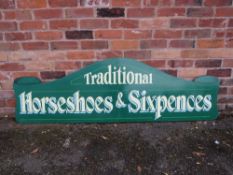 A MODERN FOLDING PAINTED WOOD FAIRGROUND SIGN, inscribed 'Traditional, Horseshoes and Sixpences',