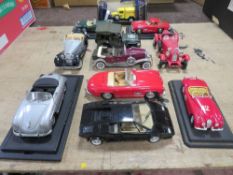 ELEVEN UNBOXED 1:18 SCALE DIE CAST VEHICLES, to include Franklin Mint Duesenburg 1930, Solido