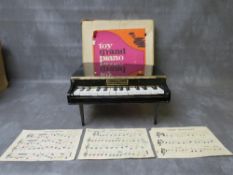 A TOY GRAND PIANO WITH OTIGINAL BOX, in working order at time of consignment