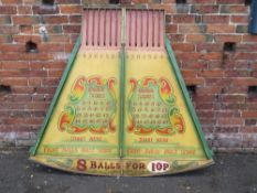 A MID 20TH CENTURY PAINTED WOOD FAIRGROUND ROLL A BALL GAME BOARD, mainly in green and yellow, 145