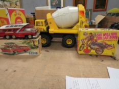 A LARGE TONKA TURBO DIESEL CONCRETE MIXER, a 1960s Chinese made tin plate bus together with a