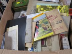 A tray of collectables to include cigarette card books, postcards etc