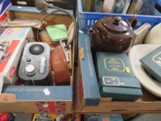 Two trays of sundries to include a boxed solid state Rolls Royce Phantom 2, postcards, dressing