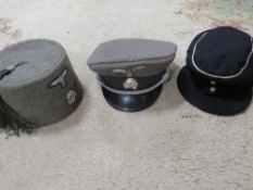 Three reproduction German WW2 headdresses