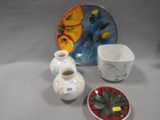 A Poole Studio 'Poppy' pattern plate, together with a selection of Poole pottery to include a