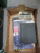 A tray of ephemera to include vintage posters to include Flash Gordon, atlas of baillieres, atlas of