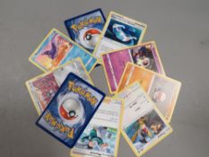 A box of vintage Pokemon cards - including holo cards
