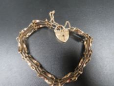 A hallmarked 9 carat gold gate bracelet approx. weight 6.9g