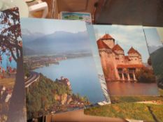 A tray of ephemera to include a photo album with postcards from Switzerland, Viewmaster reels etc