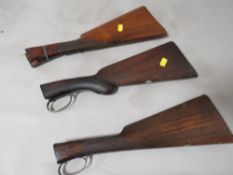 Three wooden five arm butts