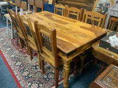 A colonial hardwood and banded dining table with six chairs