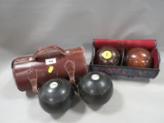 Two pairs of vintage lawn bowls