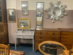 A quantity of six assorted mirrors including a plastic silver sunburst example