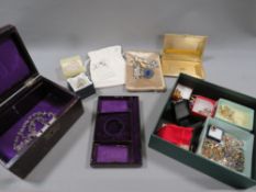 A tray of assorted costume jewellery to include a Moroccan leather jewellery box