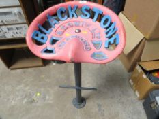 A cast iron tractor seat