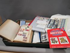 A tray of assorted British and world stamps
