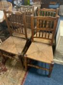 A near set of four antique oak spindle back rush seated chairs