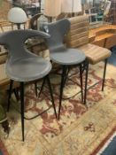 Three modern assorted leather bar/kitchen stools