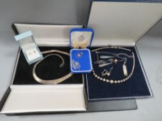 A collection of silver necklaces etc