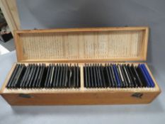 A wooden case of vintage magic lantern slides manly industrial scenes