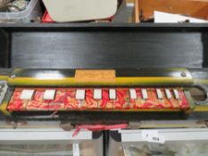 A cased Golden Deer banjo