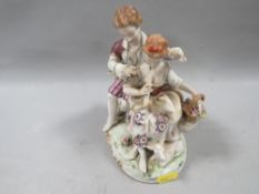 An Unter Weiss Bach Dresden couple figurine depicting girl playing the flute