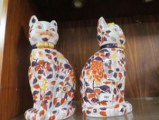 Two large modern reproduction ceramic cats