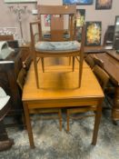 A mid-century teak extending dining table together with six chairs A/F