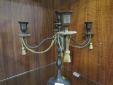 A five branch candelabra with gilt metal rope and tassel decoration