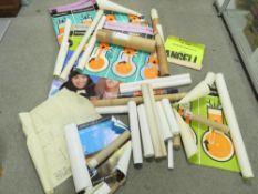 A selection of movie posters, information posters of engine stroke cycles, maps etc