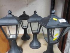 A box of four garden lamps