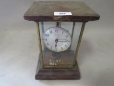 A Boulle early electric mantel clock under a glass case