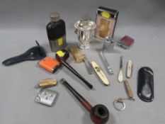 A tray of collectables to include pocket knives, cigarette lighters etc