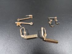 A selection of yellow metal earrings