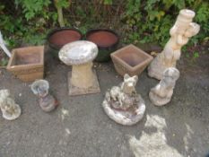 A selection of planters and concrete garden ornaments
